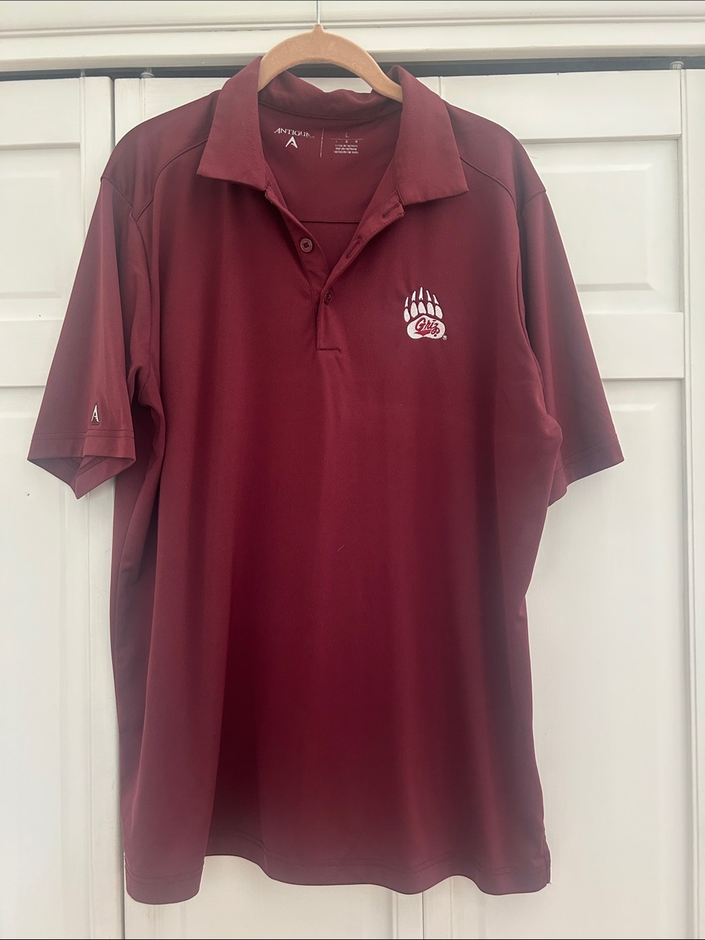 University of Montana Antigua Maroon Performance Polo with Griz Paw Embroidery